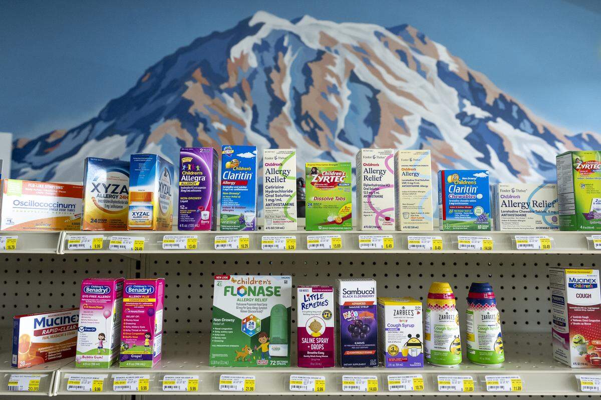 Allergy medications sit in front of a mural of Mount Rainier at Hart Family Pharmacy on Monday, Oct. 27, 2025, in Graham.