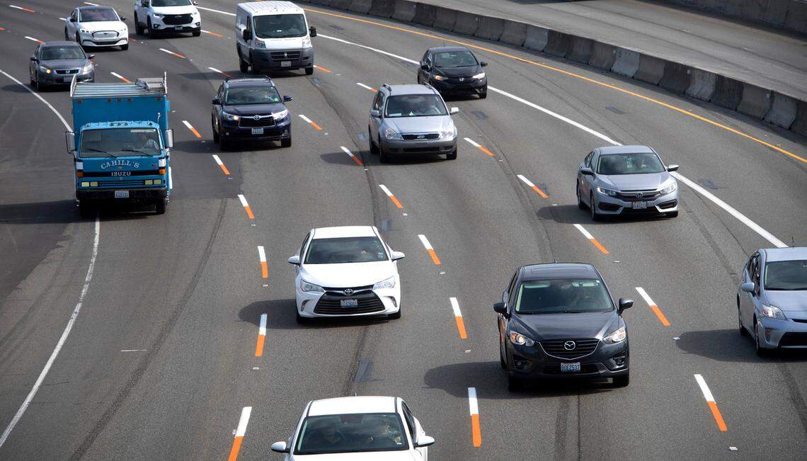 Orange test stripes have been added to the traffic lanes through the construction site along Interstate 5 through Fife, Washington, shown on Thursday, June 8, 2023. 