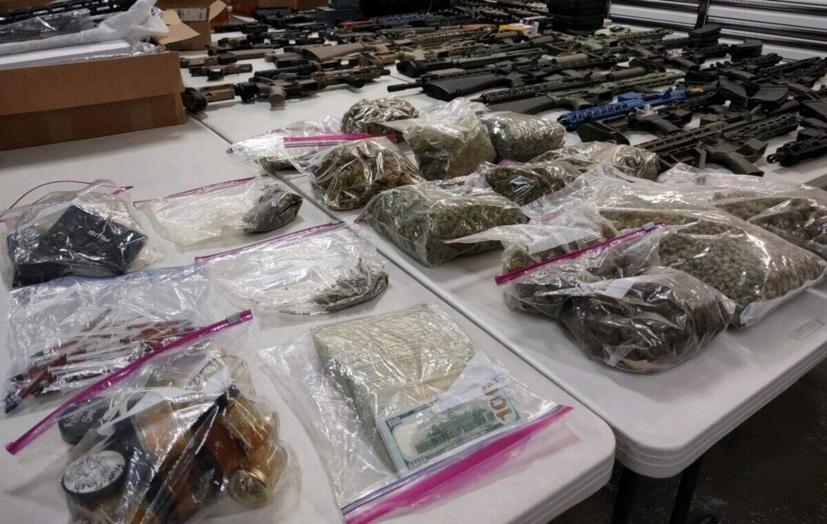 A 24-year-old Edgewood man was recently arrested in northeast Nevada after being stopped for speeding on a highway, allegedly in possession of dozens of assault-style weapons, pounds of marijuana and about $12,500 cash.