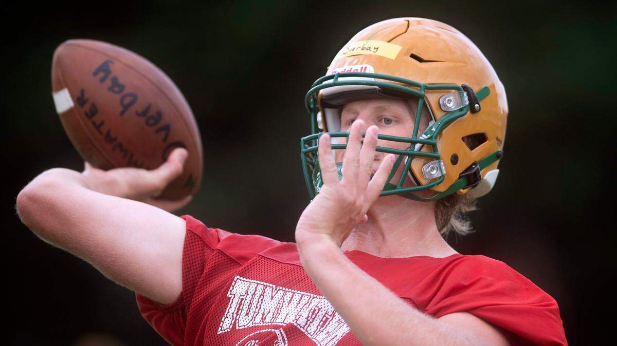 Tumwater seniors quarterback Alex Overbay fires passes during football practice at Tumwater District Stadium in Tumwater, Washington on Friday, Aug. 19, 2022.