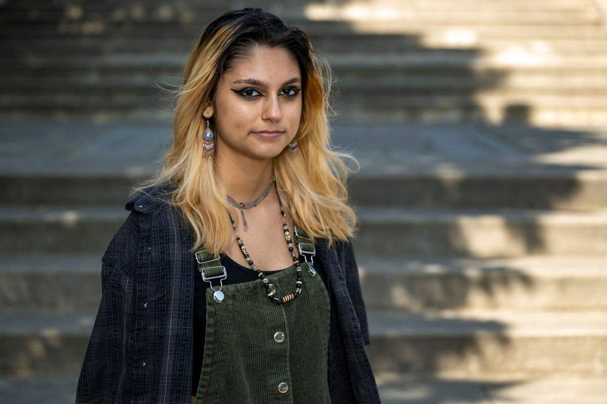 Billy, a 16-year-old in the Clover Park School District, poses for a portrait in downtown Tacoma on Thursday, July 6, 2023. Billy identifies as a non-binary trans masculine person who uses they/them pronouns (they describe their gender as having both masculine and feminine parts).