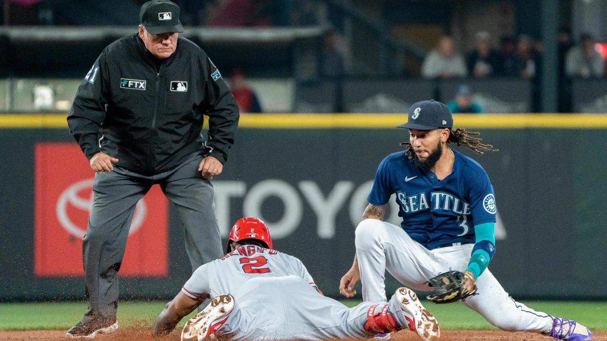 Seattle Mariners shortstop J.P. Crawford (3) attempts to get LA Angels second baseman Luis Rengifo (2) during their second game the L.A. Angels at T-Mobile Park in Seattle, Wash., on Saturday June 18, 2022. The Mariners lost both games to the Angels 4-2 and 3-0.