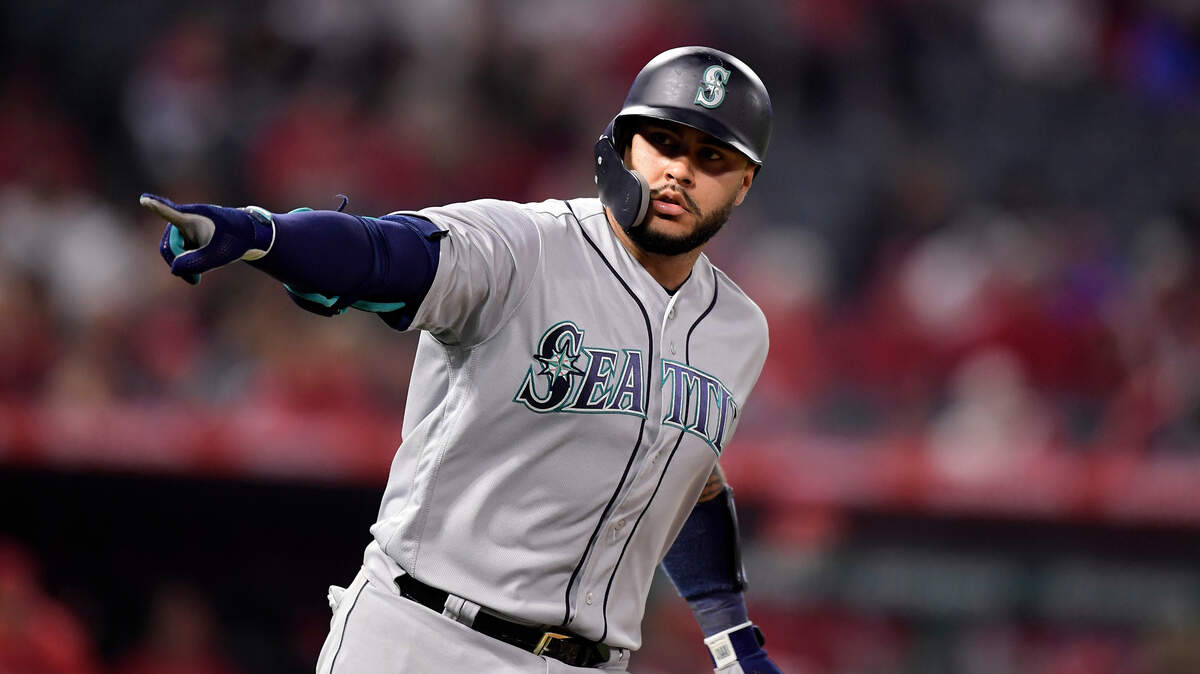Seattle Mariners’ Omar Narvaez points to his dugout as he round first after hitting a solo home run during the ninth inning of the team’s baseball game against the Los Angeles Angels on Friday, April 19, 2019, in Anaheim, Calif.