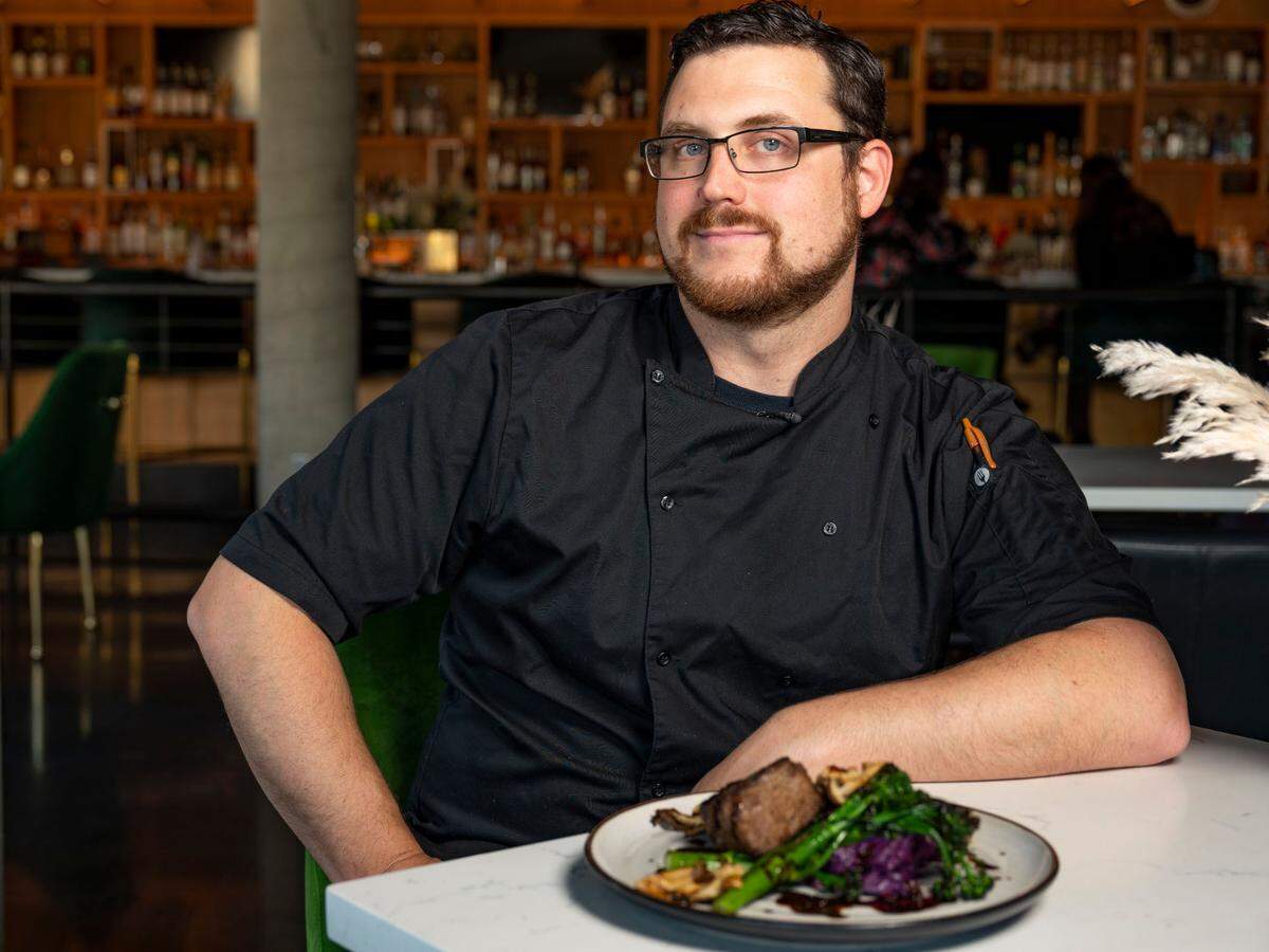 At ALMA Lounge, a restaurant and cocktail bar in Tacoma, Wash., executive sous chef Kevin Michalk, pictured here, and executive chef Ramon Shiloh cook contemporary indigenous foods made with local ingredients. A bison steak with a duck bordelaise joins Adam’s Mushrooms, charred broccolini and purple sweet potatoes, pictured here on March 9, 2022.