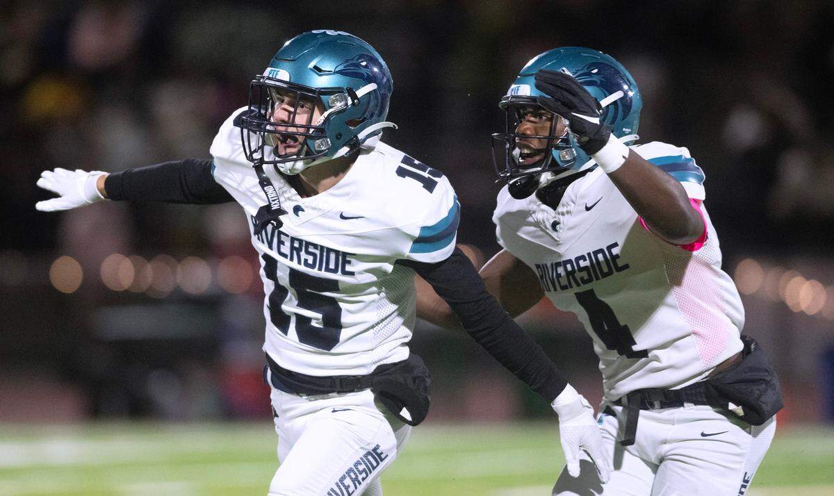 Auburn Riverside defensive back Isaac Mospanko (15) celebrates his second interception of the game during Friday night’s 3A NPSL championship game against the Auburn Trojans at Auburn Memorial Stadium in Auburn, Washington, on Oct. 27, 2023. Auburn Riverside won the game, 41-14.