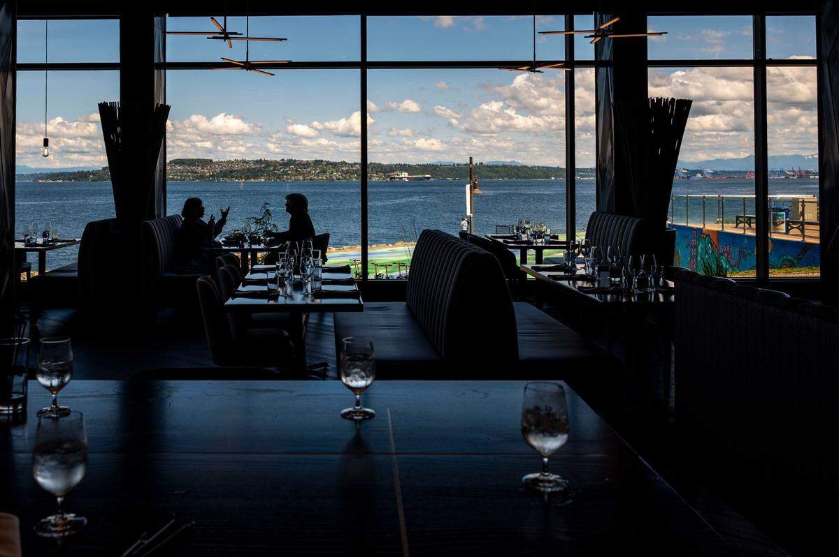 Floor-to-ceiling windows accentuate the views from Copper & Salt at the Silver Cloud Hotel Tacoma.