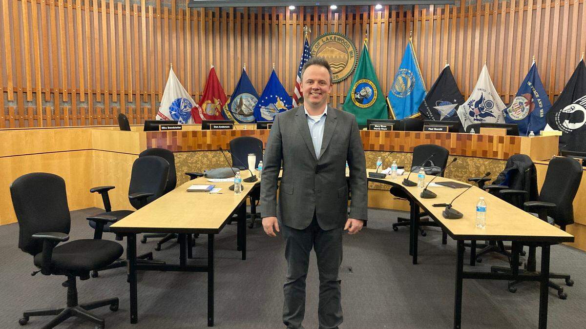 Newly appointed Lakewood City Council member Trestin Lauricella stands in the council chambers on March 13, 2023.