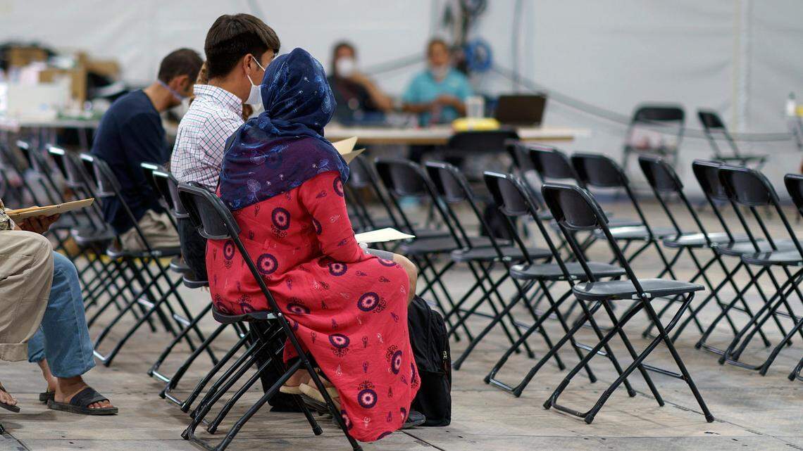 Afghan refugees are processed at Fort Bliss’ Doña Ana Village where they are being housed in New Mexico, Friday, Sept. 10, 2021. The Biden administration provided the first public look inside the U.S. military base where Afghans airlifted out of Afghanistan are screened, amid questions about how the government is caring for the refugees and vetting them. (AP Photo/David Goldman)