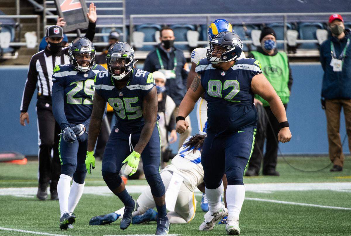 Seattle Seahawks defensive end Benson Mayowa celebrates a tackle. The Seattle Seahawks played the Los Angeles Rams in a NFL football game at Lumen Field in Seattle, Wash., on Sunday, Dec. 27, 2020.