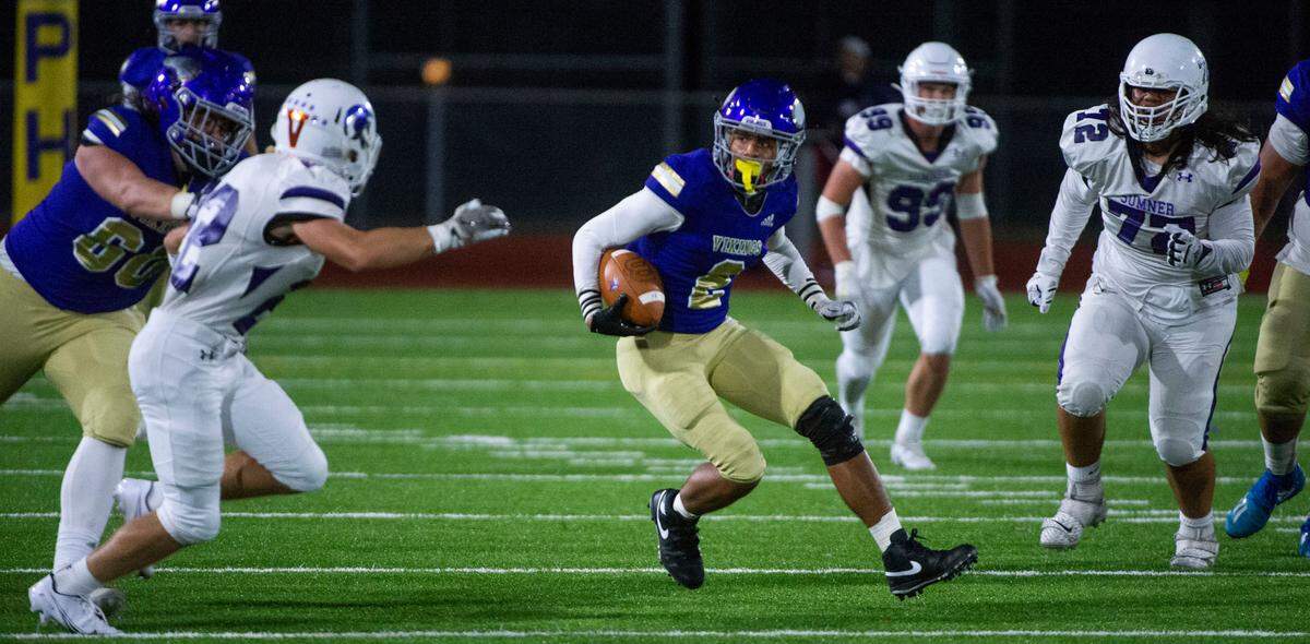 Puyallup reciever Jordan Dwyer, who had 5 catches for 106 yards, looks for running room as the Vikings attempted to mount a final scoring drive in the waning minutes of their 26-21 loss to the Spartans at Sparks Stadium on Friday, Sept. 17, 2021.