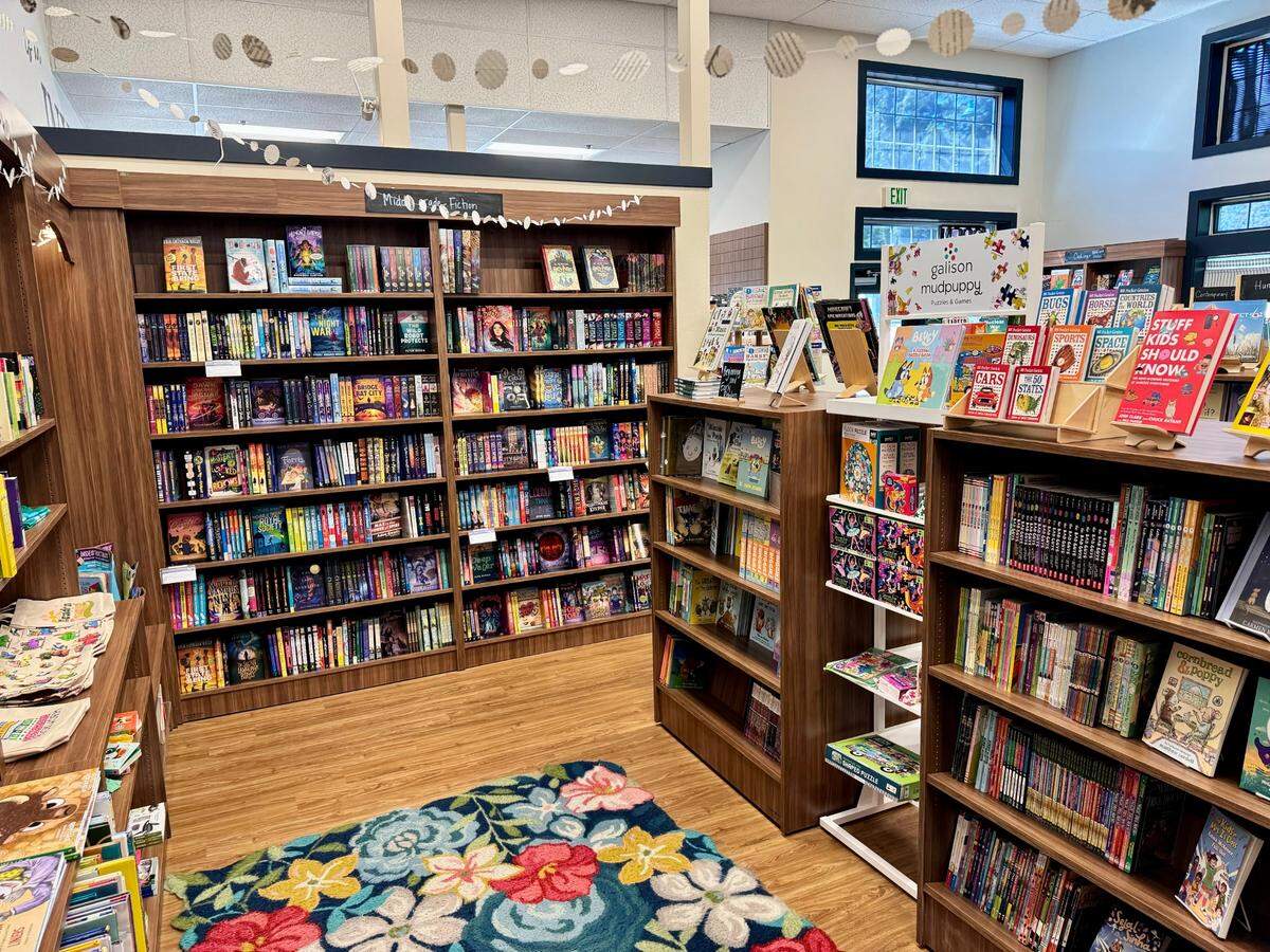 Books line the shelves inside Invitation Bookshop’s existing location on Olympic Drive in Gig Harbor, Wash.