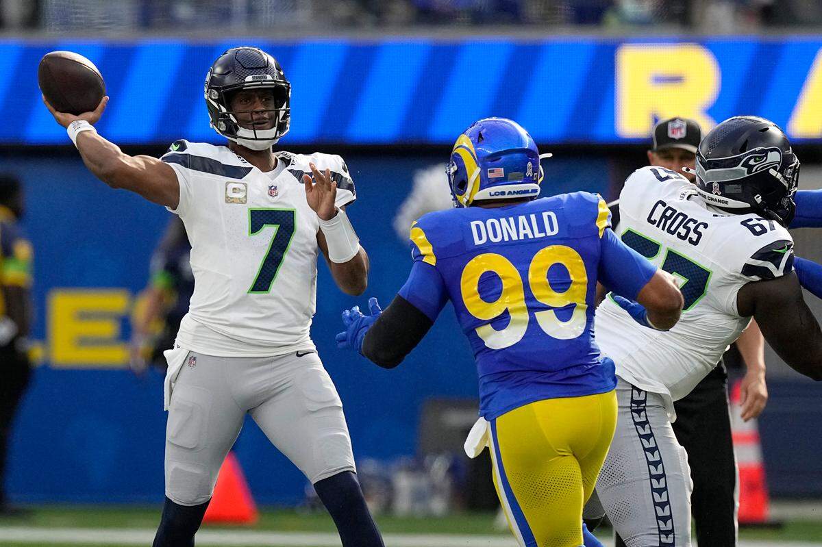 Seattle Seahawks quarterback Geno Smith (7) throws under pressure during the first half of an NFL football game against the Los Angeles Rams Sunday, Nov. 19, 2023, in Inglewood, Calif. (AP Photo/Mark J. Terrill)