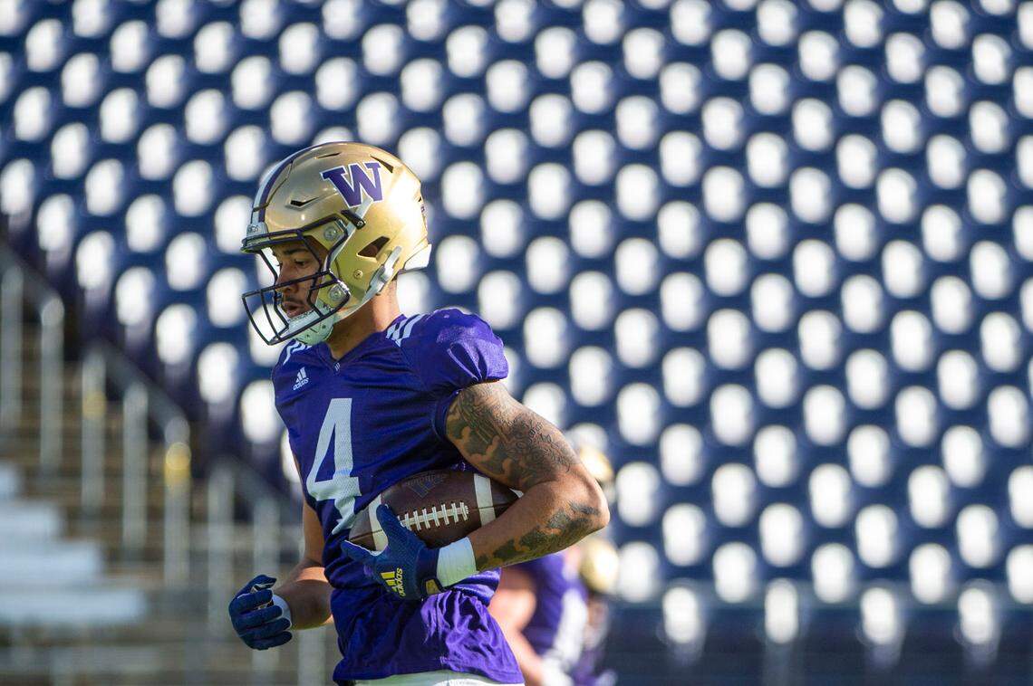 Washington receiver Lonyatta Alexander, Jr. jogs down the field after catching a pass during drills at spring practice on Friday, April 8, 2022, at Husky Stadium in Seattle.