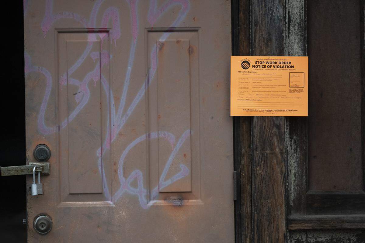 A stop work order is posted on the outside of the historic Alderton School gym on Tuesday, May 19, 2026.