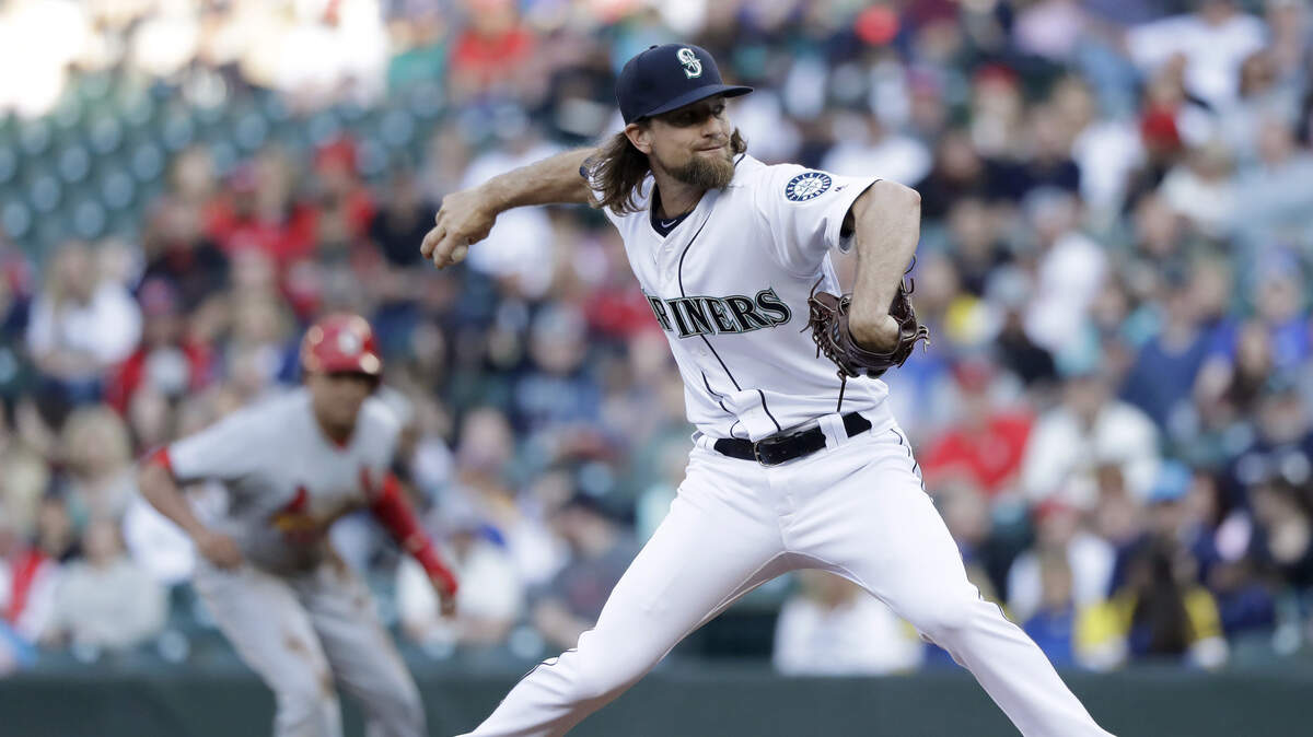 Seattle Mariners starting pitcher Mike Leake throws as St. Louis Cardinals’ Yairo Munoz leads off at first base during the first inning of a baseball game Wednesday, July 3, 2019, in Seattle.