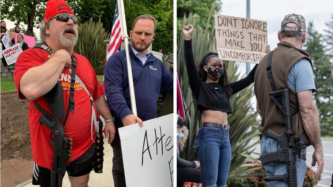 In photo at left, an unidentified man with a shotgun and a bandolier full of shells stands next to state Rep. Jesse Young (R-Gig Harbor,) with flag. At right, a man wearing an AR-15-style automatic rifle passes a demonstrator, Kiki Mamea, 16, a student at Gig Harbor High School.
