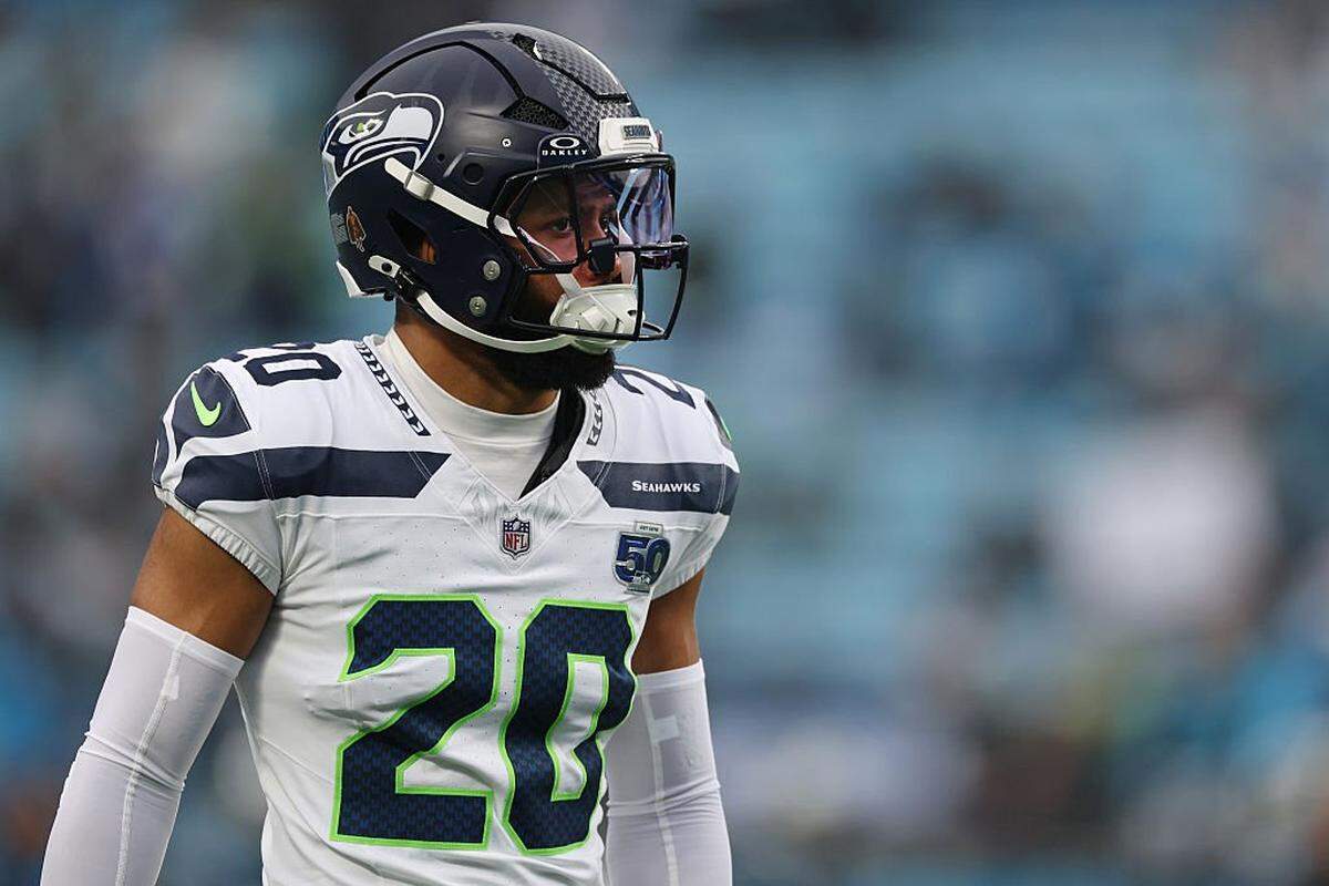 CHARLOTTE, NORTH CAROLINA - DECEMBER 28: Julian Love #20 of the Seattle Seahawks warms up prior to a game against the Carolina Panthers at Bank of America Stadium on December 28, 2025 in Charlotte, North Carolina. (Photo by David Jensen/Getty Images)