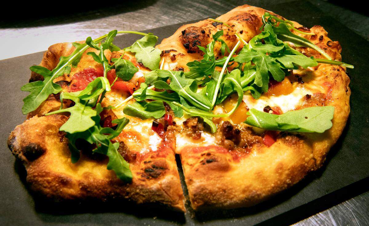 Fennel sausage pizza with pickled peppers and local mushrooms at the new Incalmo restaurant adjacent to the Museum of Glass in downtown Tacoma, Washington, on Wednesday, Dec. 22, 2021.