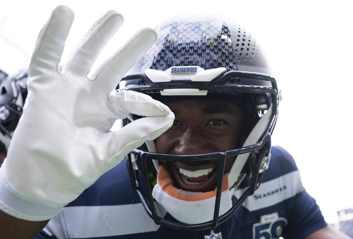 Seattle Seahawks wide receiver Tory Horton (15) clocks it after scoring a touchdown on a 95-yard punt return during the first quarter of the game against the New Orleans Saints at Lumen Field, on Sunday, Sept. 21, 2025 in Seattle.