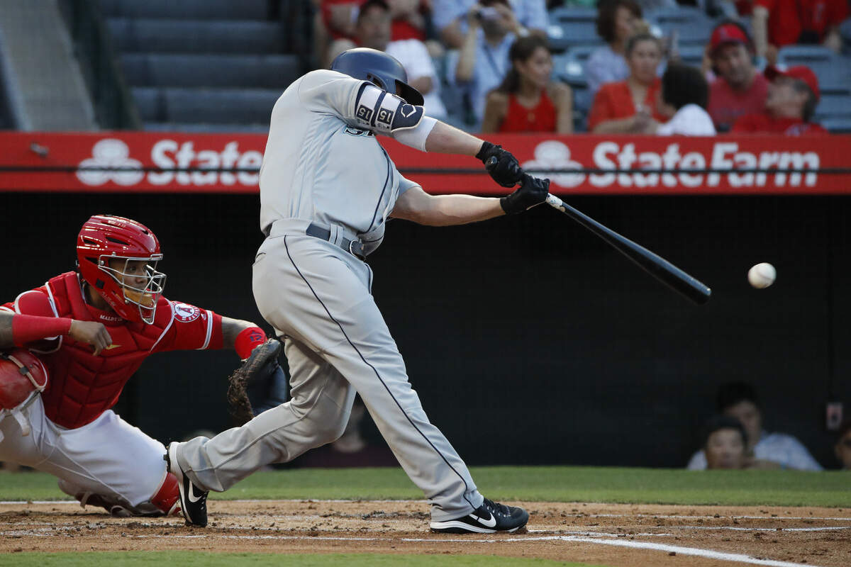 Seattle Mariners’ Kyle Seager connects with an RBI single during the first inning of a baseball game against the Los Angeles Angels, Thursday, July 12, 2018, in Anaheim, Calif. (AP Photo/Jae C. Hong)