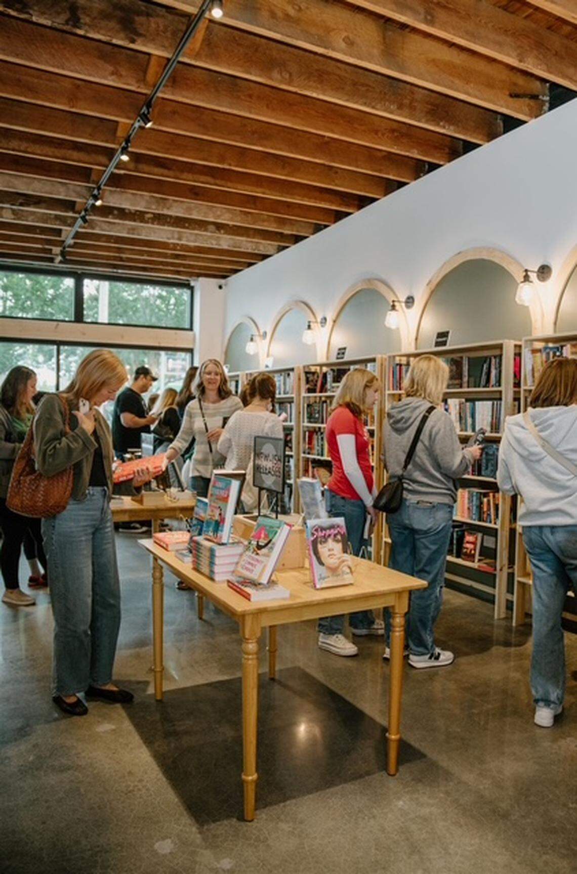 Customers shop at Page & Pine, Puyallup’s newest bookstore, during its soft opening week. The store first launched its soft opening on June 27.