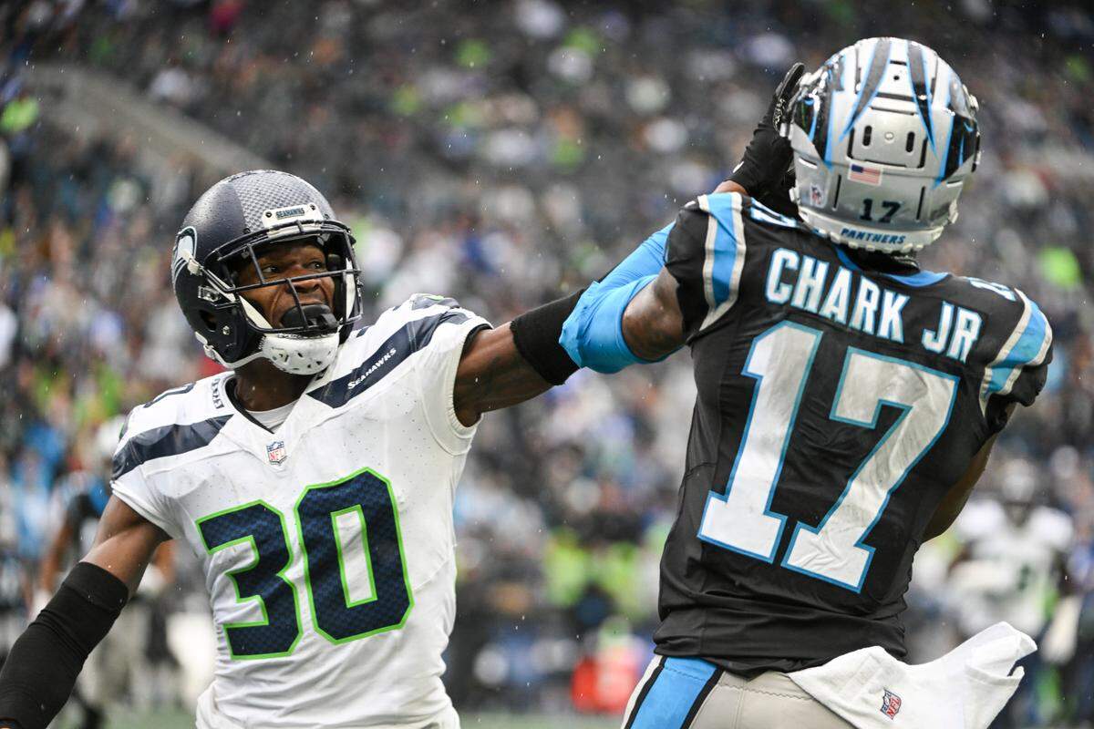 Seattle Seahawks cornerback Michael Jackson (30) breaks up a pass intended for Carolina Panthers wide receiver DJ Chark Jr. (17) during the fourth quarter of the game at Lumen Field, Sunday, Sept. 24, 2023, Seattle, Wash.