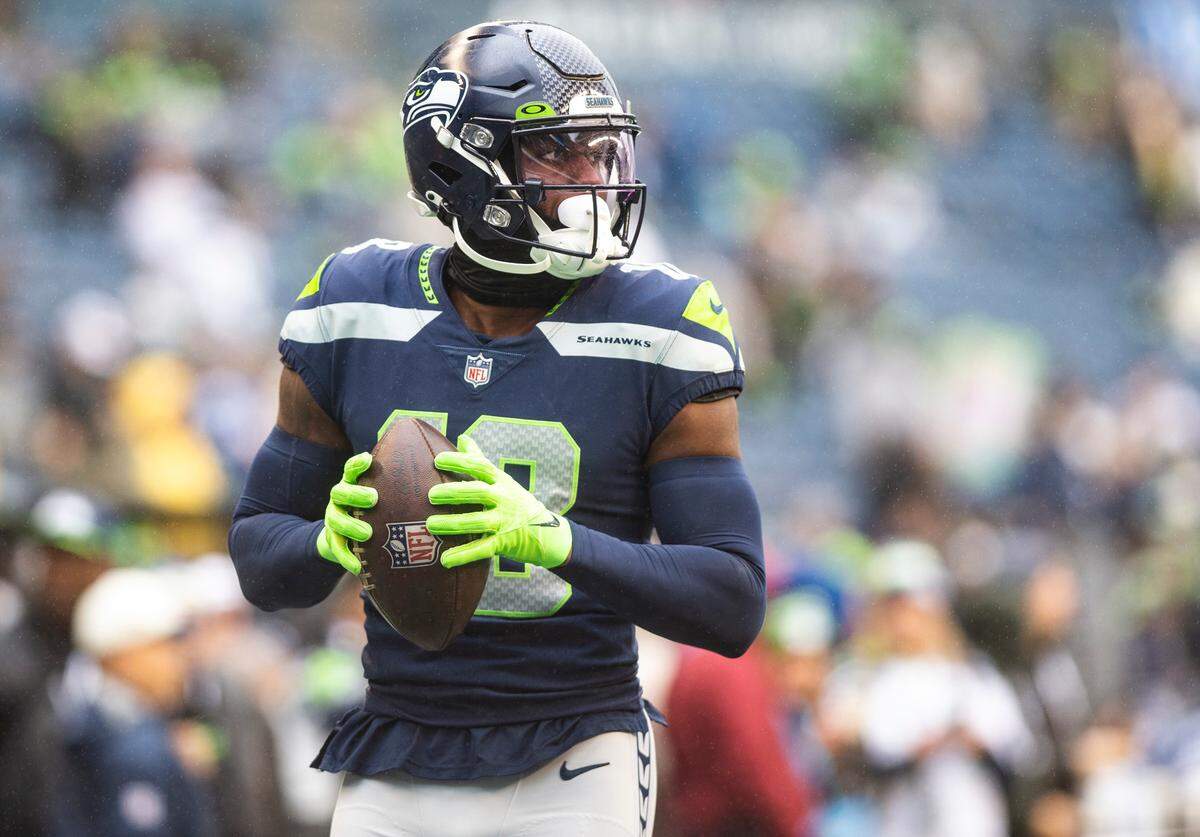Seattle Seahawks wide receiver Laquon Treadwell (18) warms up before the start of an NFL game against the California Panthers at Lumen Field in Seattle Wash., on Dec. 11, 2022.