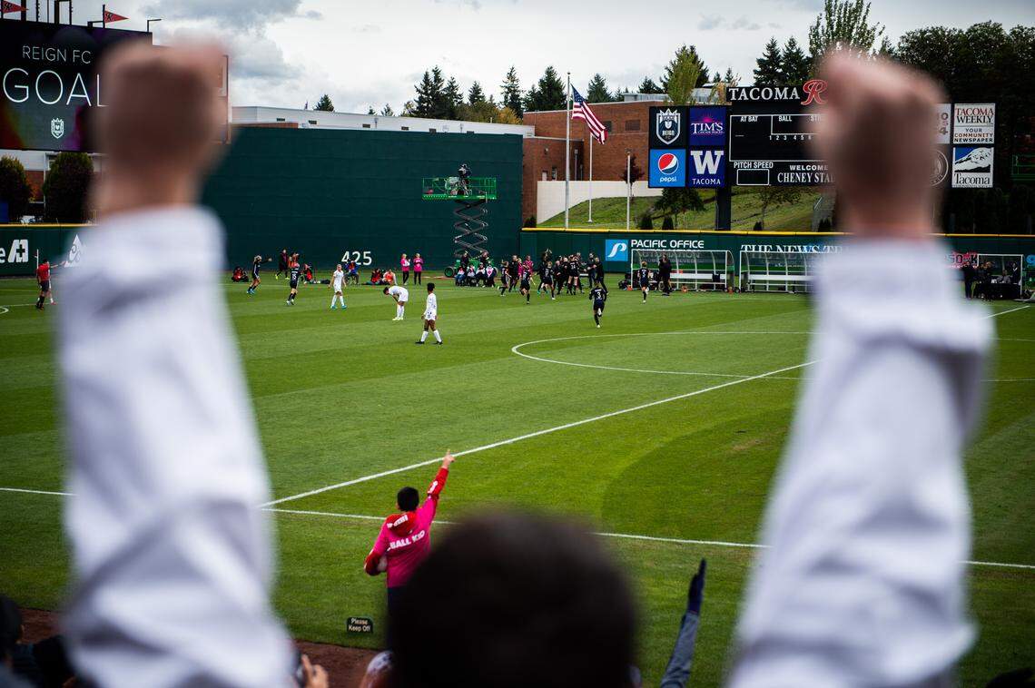 Fans and players celebrate a goal by Reign FC forward Bethany Balcer (24) during the second half. Reign FC played Portland Thorns FC in a NWSL soccer match at Cheney Stadium in Tacoma, Wash., on Sunday, Sept. 29, 2019.