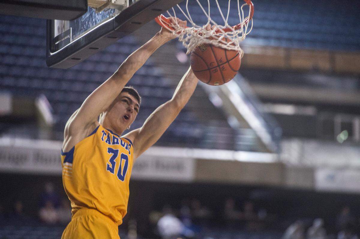 Tahoma forward Carson Talbert throws down a dunk in the fourth quarter. Tahoma beat Graham-Kapowsin, 64-44, in a Class 4A state basketball loser-out consolation game on Friday, March 4, 2022 at the Tacoma Dome in Tacoma, Wash.