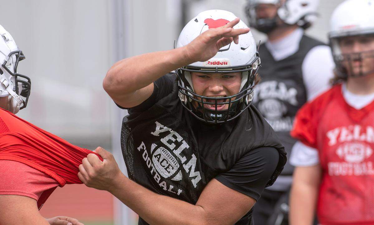 Yelm defensive lineman Chris Hauss runs through drills during the opening day of football practice at Yelm High School in Yelm, Washington, on Wednesday, Aug. 21, 2024.