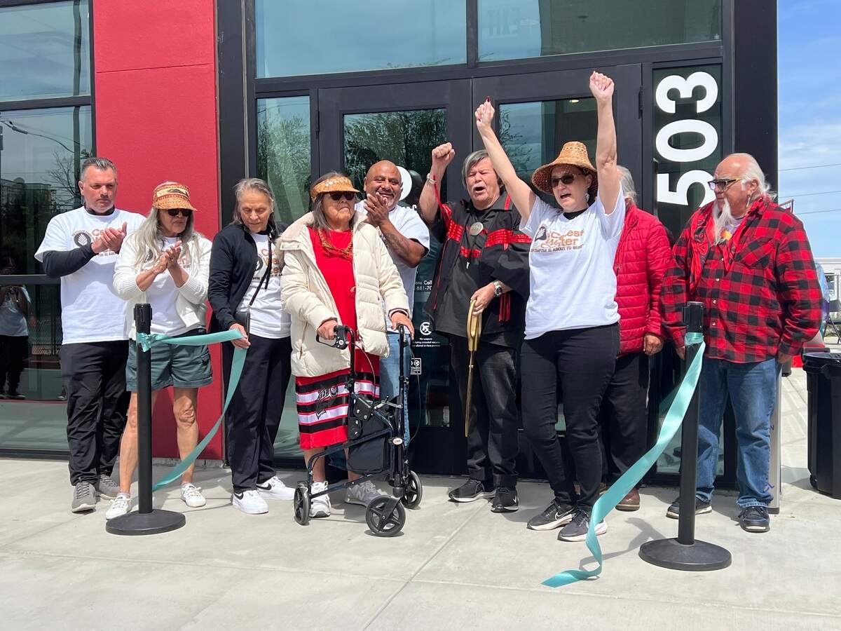 Members of the Puyallup Tribal Council celebrate the opening of the Cedar Wellness Center near the Tacoma Dome on Friday, May 3.