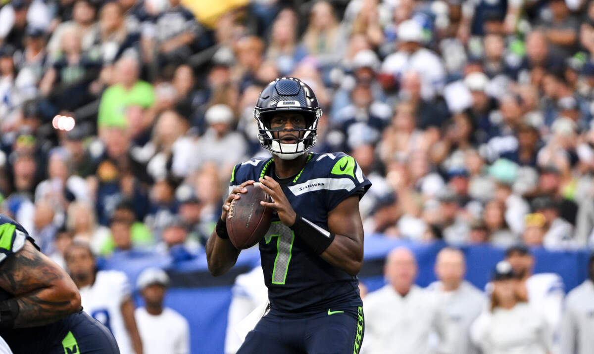 Seattle Seahawks quarterback Geno Smith (7) looks to the throw during the first quarter of the preseason game against the Dallas Cowboys at Lumen Field, Saturday, Aug. 19, 2023, in Seattle, Wash.