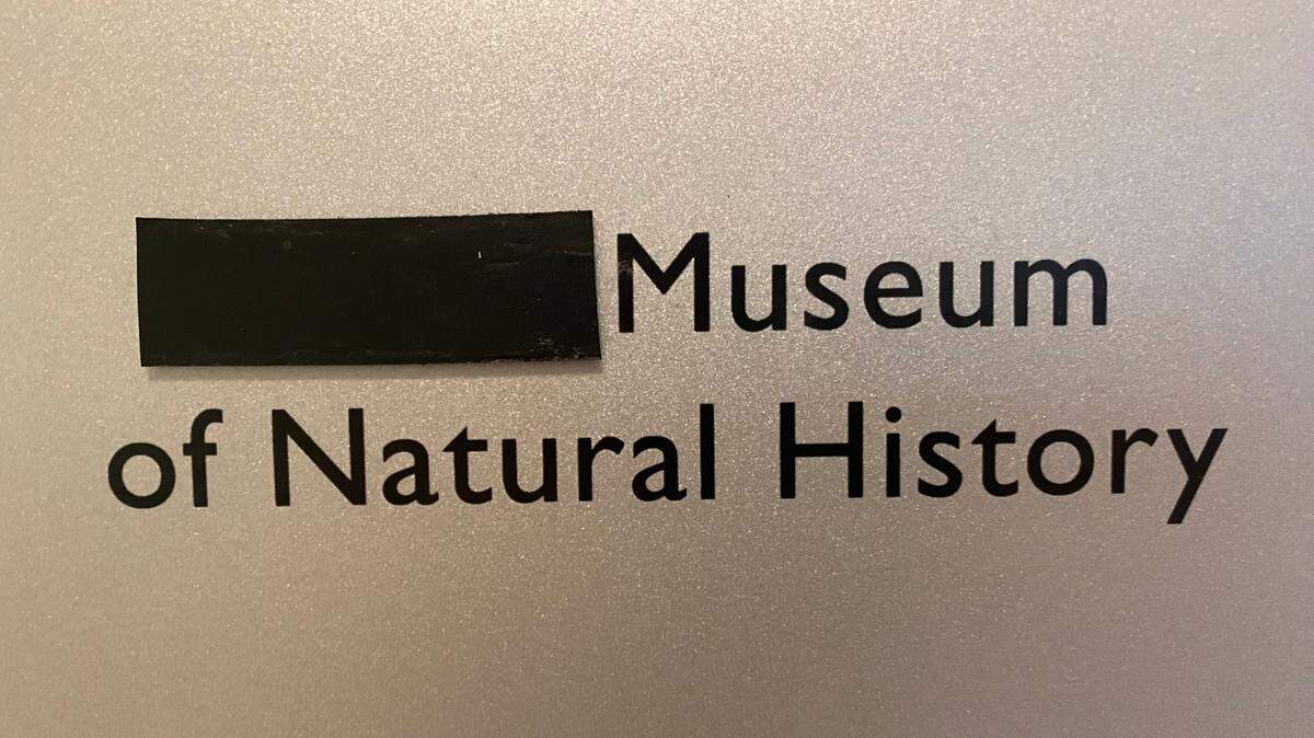 “Slater” has been covered up on a sign outside the natural history museum at the University of Puget Sound.