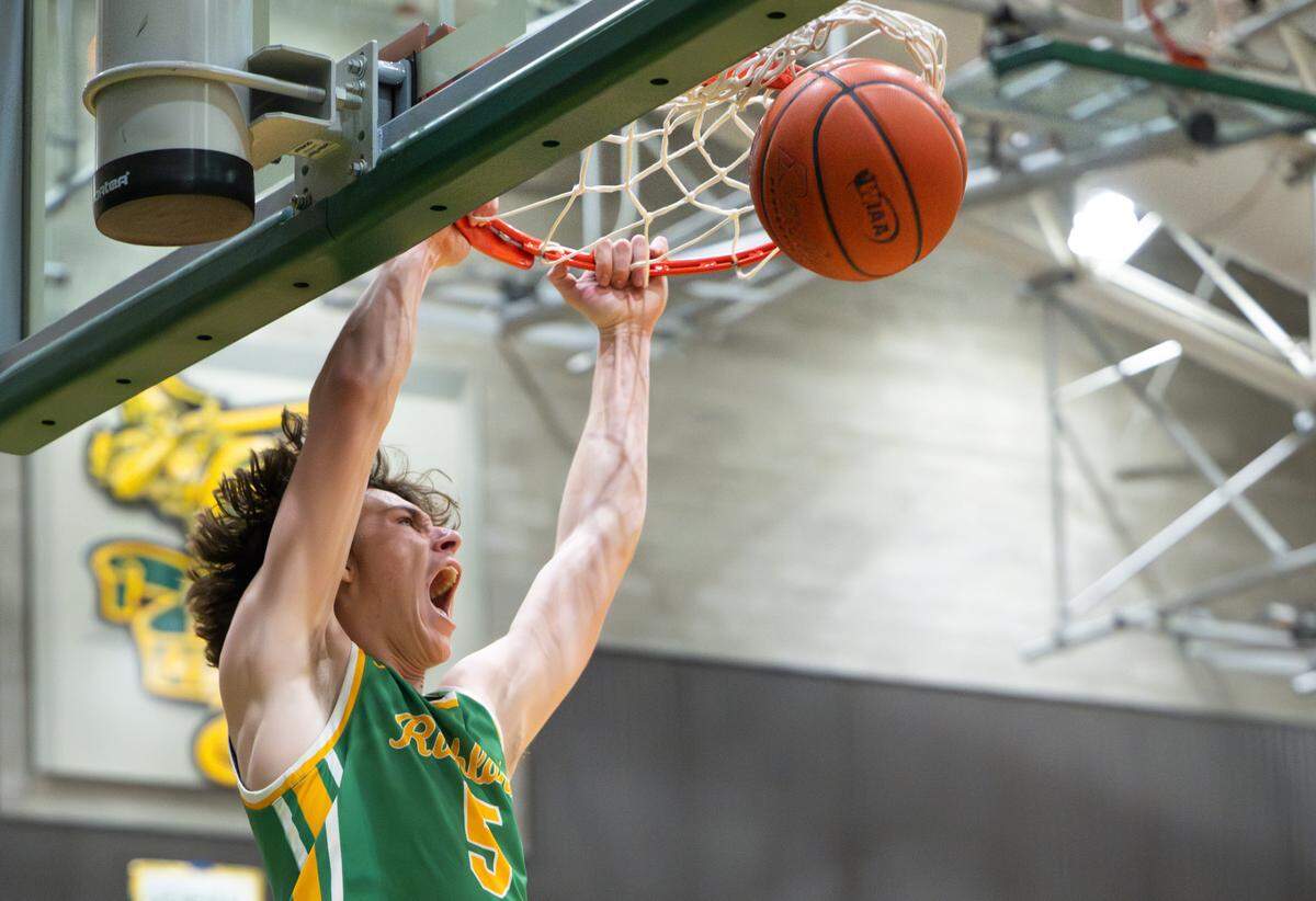 Richland’s Jack Forbes (5) jams in a go-ahead dunk in the closing minutes during the 4A state regional boys game against Tahoma at Auburn Senior High School, on Saturday, Feb. 24, 2024 in Auburn, Washington.
