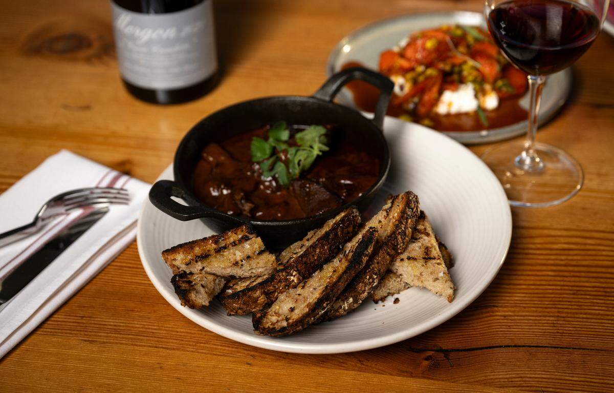 The braised elk shoulder in an ancho-huckleberry cream sauce, served with grilled sourdough, was a staple of The Table’s menu that otherwise changed frequently.