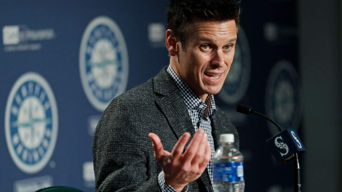 FILE - In this Jan. 25, 2018, file photo, Seattle Mariners general manager Jerry Dipoto speaks during the Mariners annual media briefing before the start of spring training baseball. As general manager Jerry Dipoto accurately explained, the Seattle Mariners are a team stuck in the middle. They’re not in the position of rebuilding. They have enough talent and enough veterans _ with big contracts _ to be competitive. But they’re not among the elite of the American League, including the Houston Astros in their own division.(AP Photo/Ted S. Warren, File)