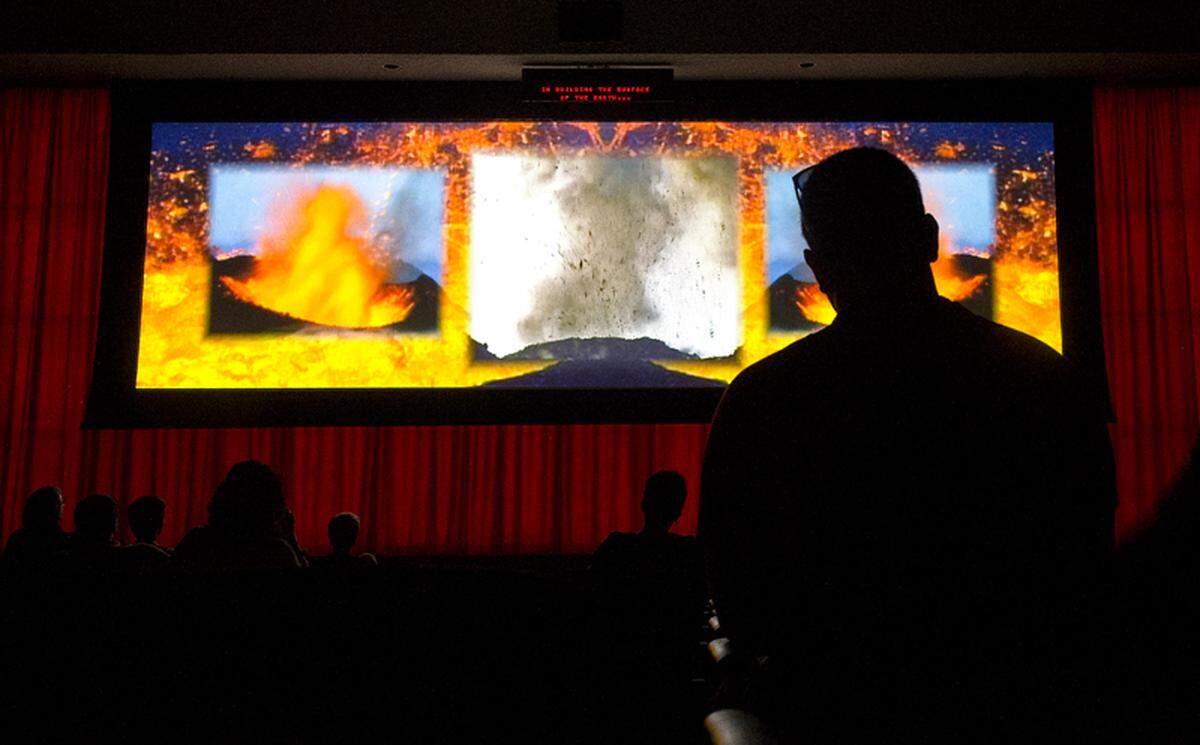 Crowds watch in rapt silence last year during a movie depicting the 1980 eruption of Mt. St. Helens at the Johnston Ridge Observatory. (Dean J. Koepfler, staff file, 2014.)