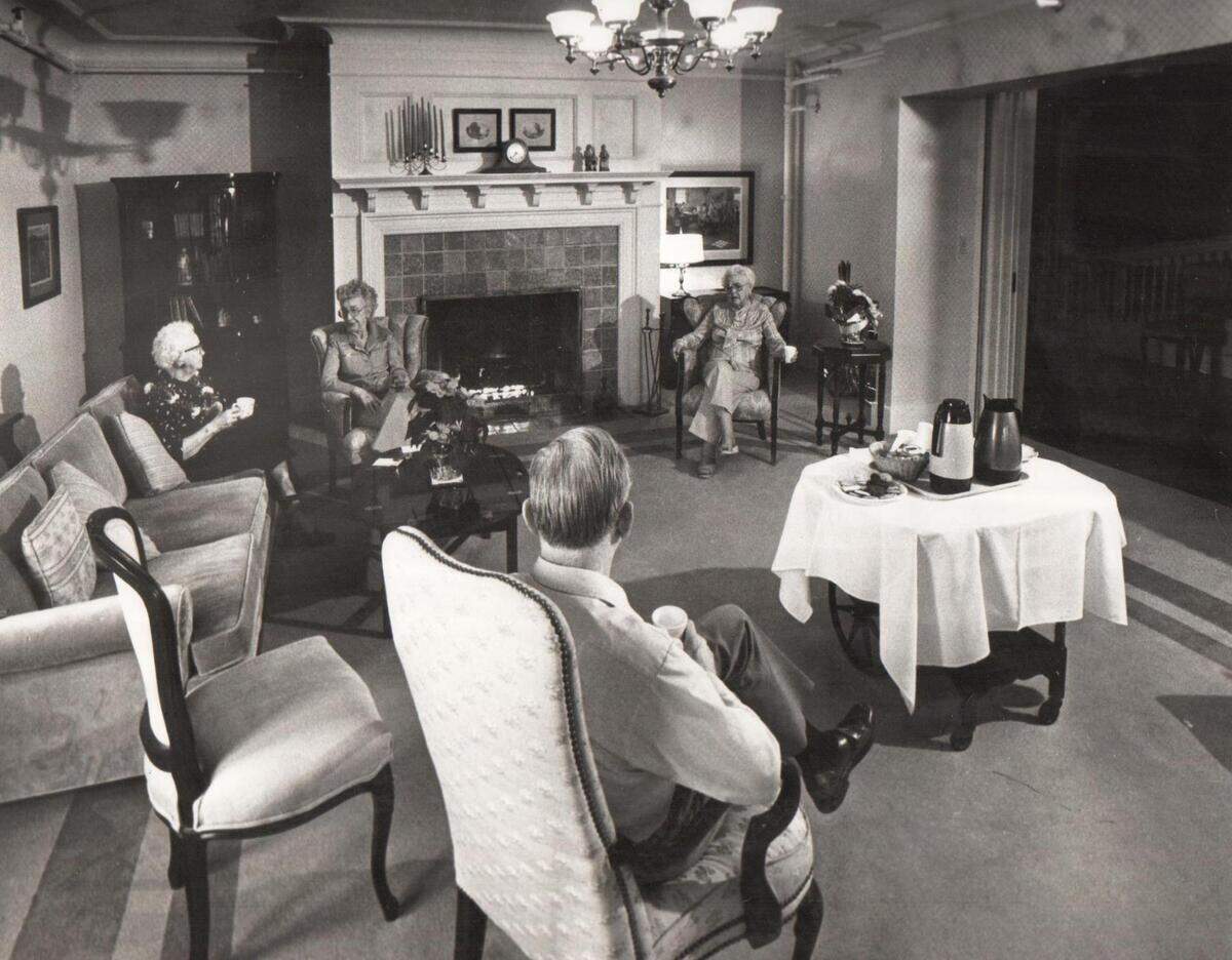 Residents of Franke Tobey Jones gather in a parlor, date unknown.