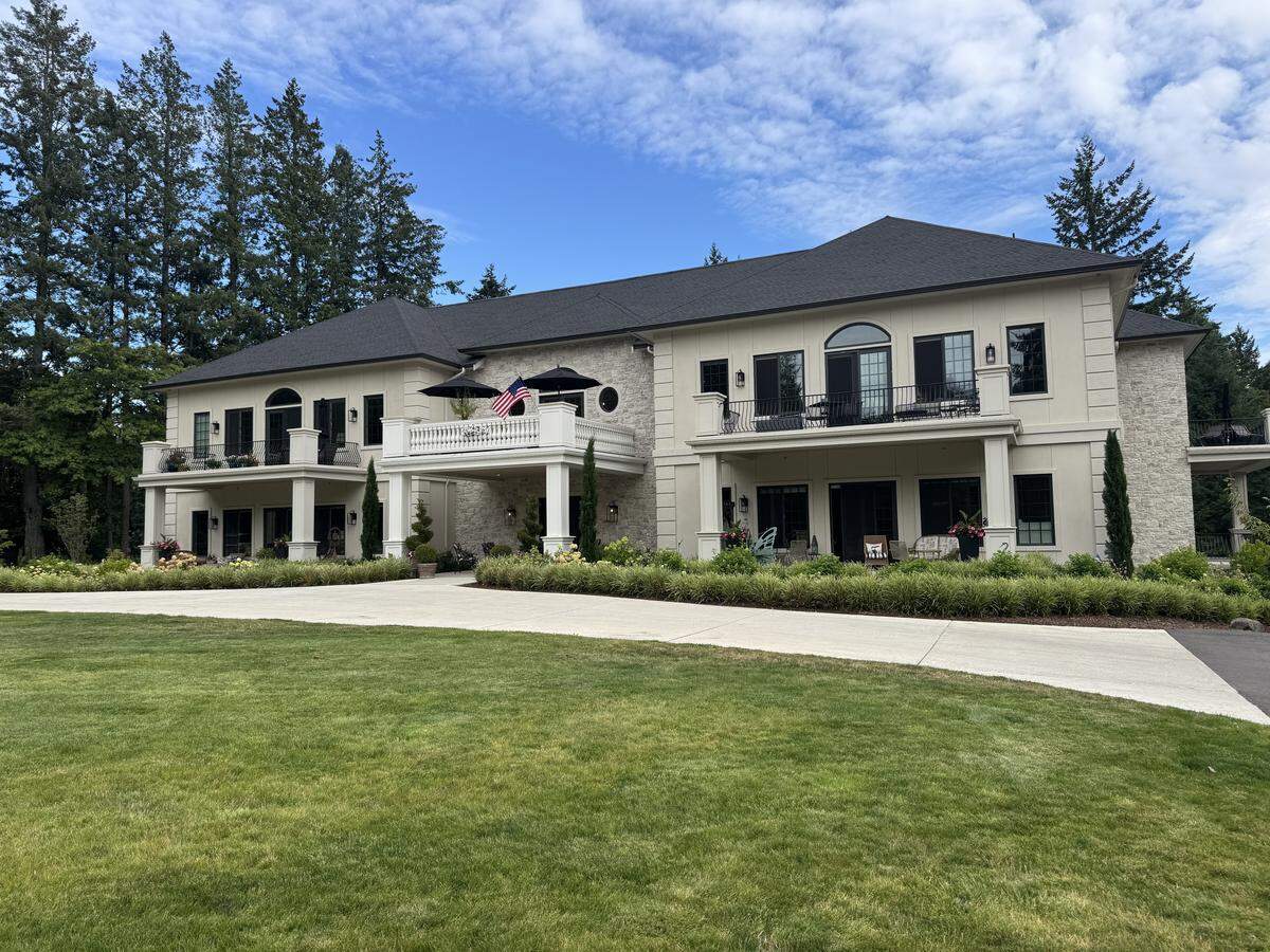 Hawksworth Villa at Kensington Gardens, a resort-style community for aging adults, includes eight suites on two floors. The building faces a spacious lawn and small apple tree orchard, Thursday, Aug. 14, 2025 in rural Pierce County, near the city of Gig Harbor, Wash.