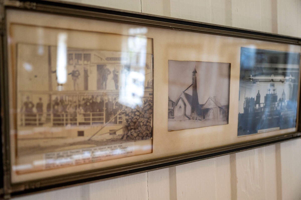 Historic pictures hang on the wall at St. Peter’s Church in the Old Town district of Tacoma, on Thursday, Aug. 10, 2023.