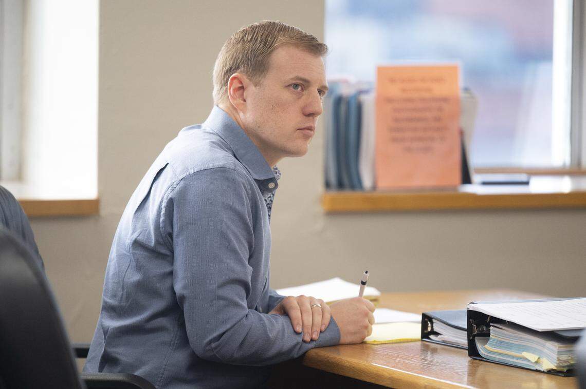 Jordan Henderson, a former teacher at Evergreen Elementary School, sits in court during his trail on Monday, Dec. 29, 2025, at Pierce County Superior Court in Tacoma, Wash. Henderson, 36, has been charged with 12 counts of first-degree child molestation.