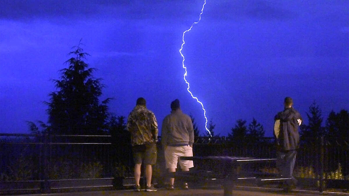 Washington state storm watchers take in lightning in this 2019 file photo.
