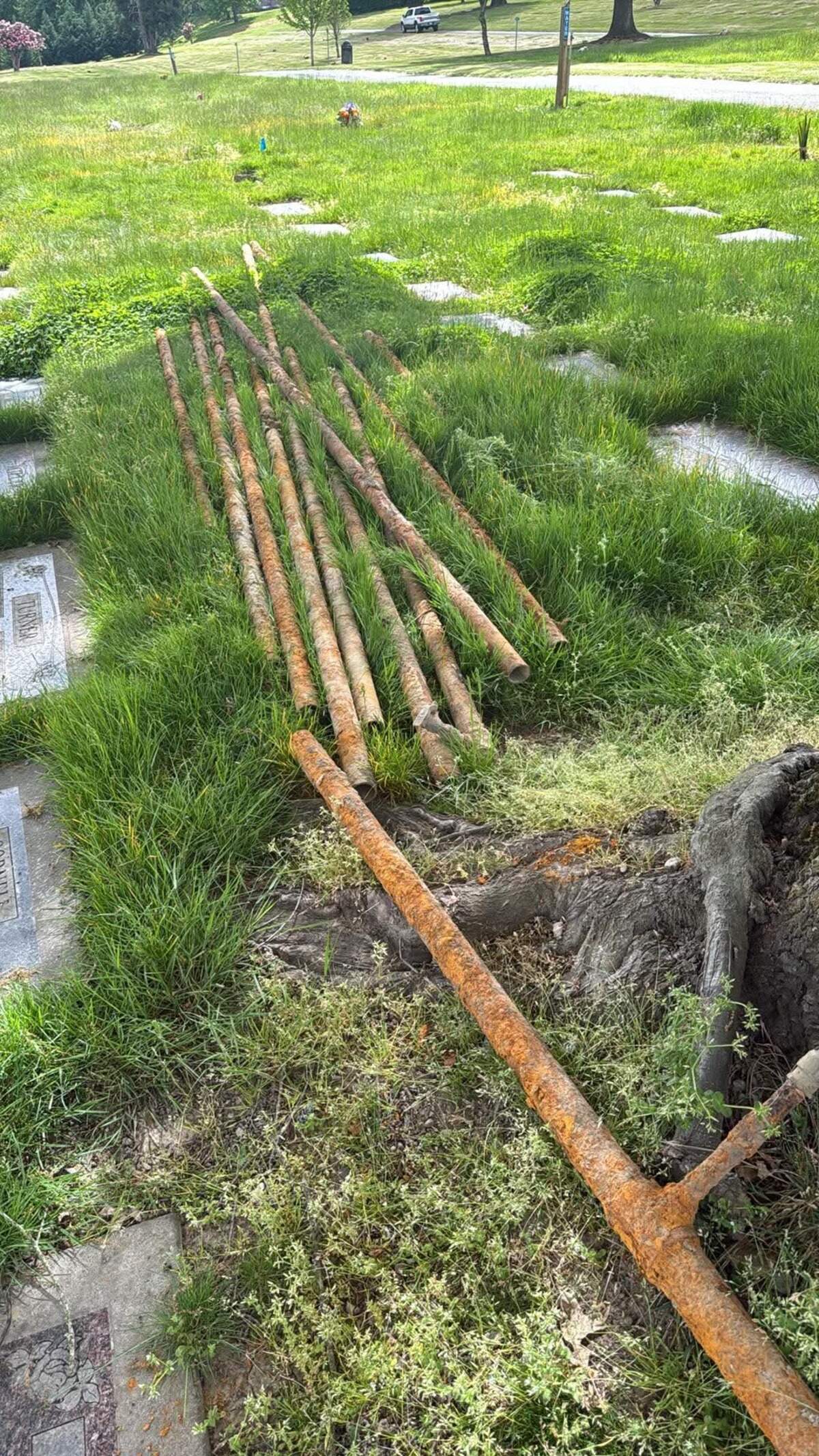 Pipes pictured on the ground at Woodbine Cemetery in Puyallup on May 10, 2026.