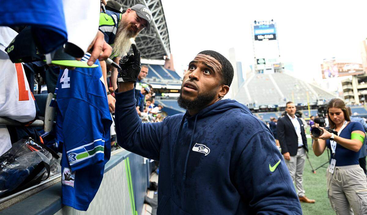 Seattle Seahawks linebacker Bobby Wagner (54) signs autographs before of the preseason game against the Minnesota Vikings at Lumen Field, Thursday, Aug. 10, 2023, in Seattle, Wash.