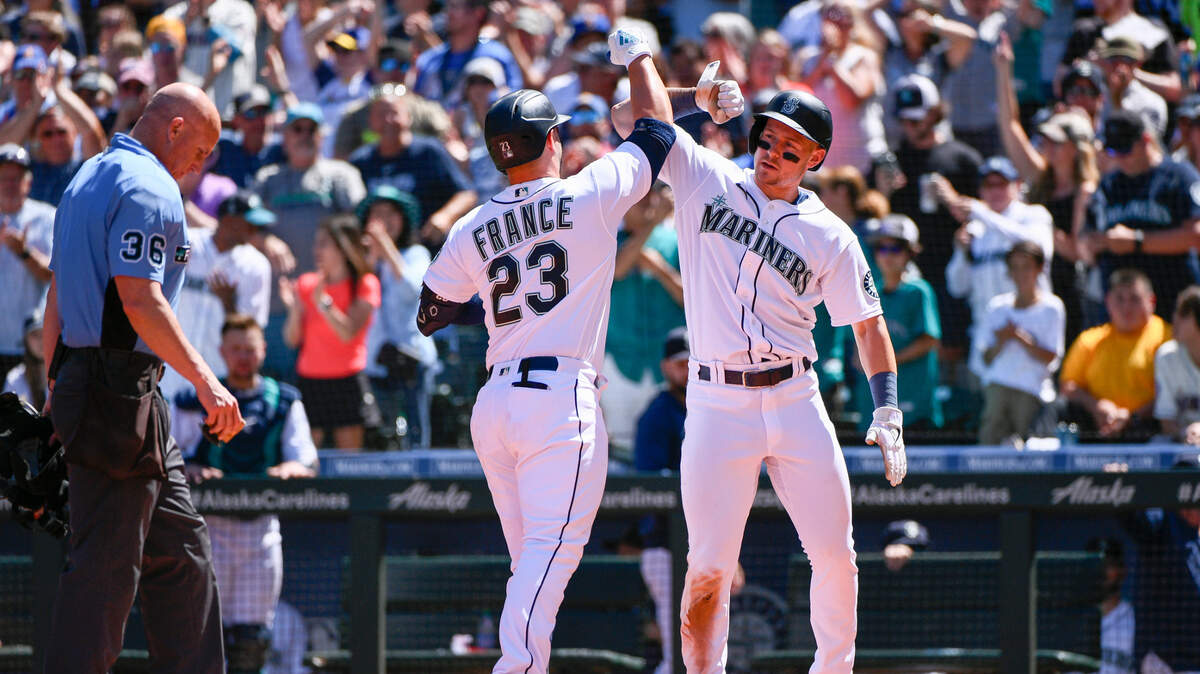Seattle Mariners’ Ty France (23) celebrates at the plate with Jarred Kelenic after hitting a two-run home run during the third inning of a baseball game against the Los Angeles Angels, Saturday, Aug. 6, 2022, in Seattle. (AP Photo/Caean Couto)