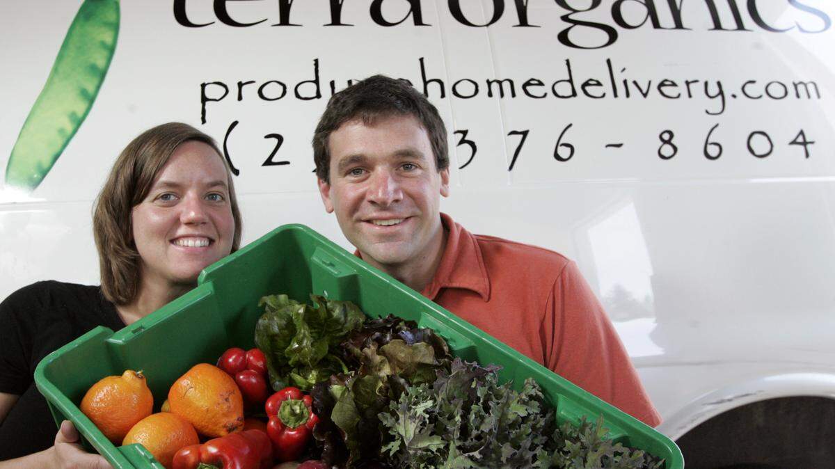 Kim and Dan Hulse run Terra Organics, a produce home delivery business out of their warehouse in East Tacoma. They gather organic produce from local farms and then distribute to customers weekly.  Photo taken at their warehouse, Monday June 16, 2008.(Janet Jensen/The News Tribune)