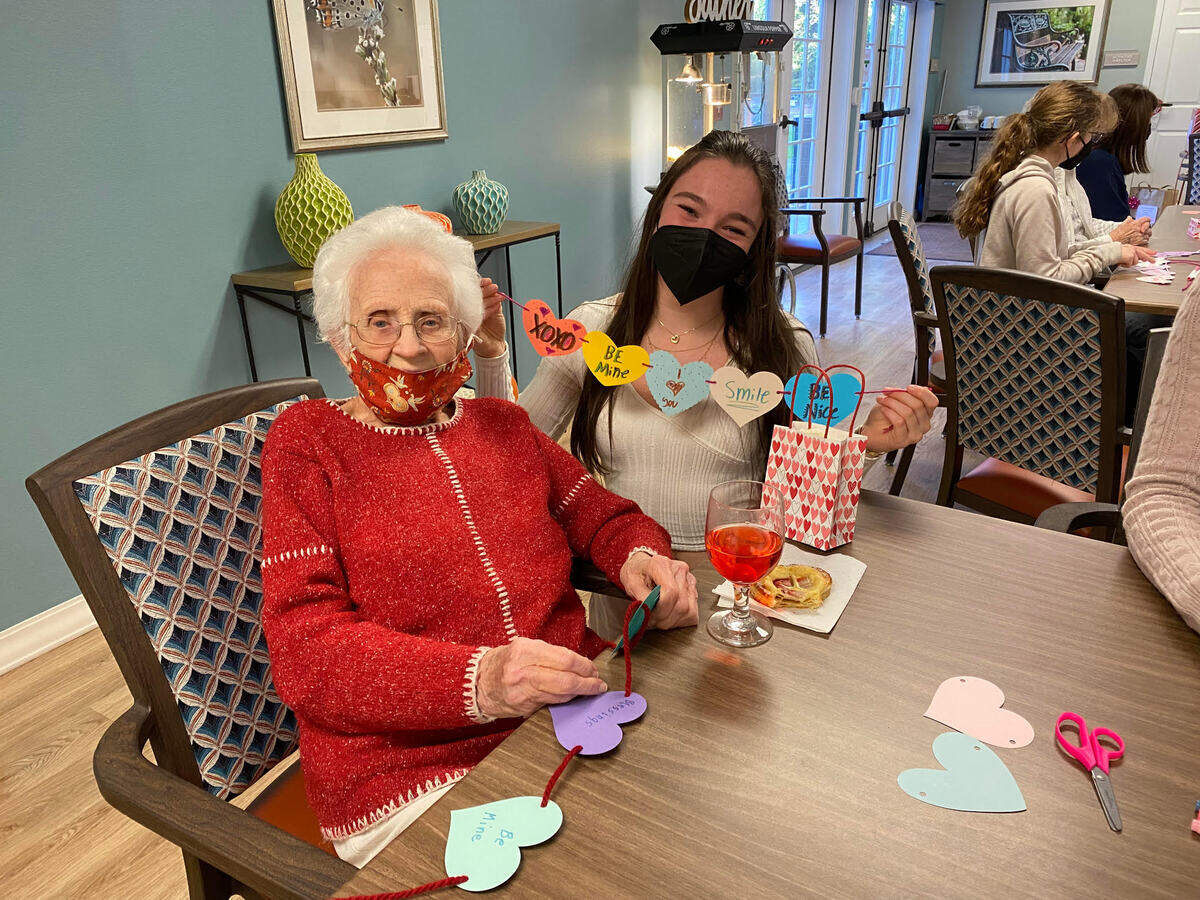 Lola Hawkins and Betty making festive crafts and becoming fast friends.
