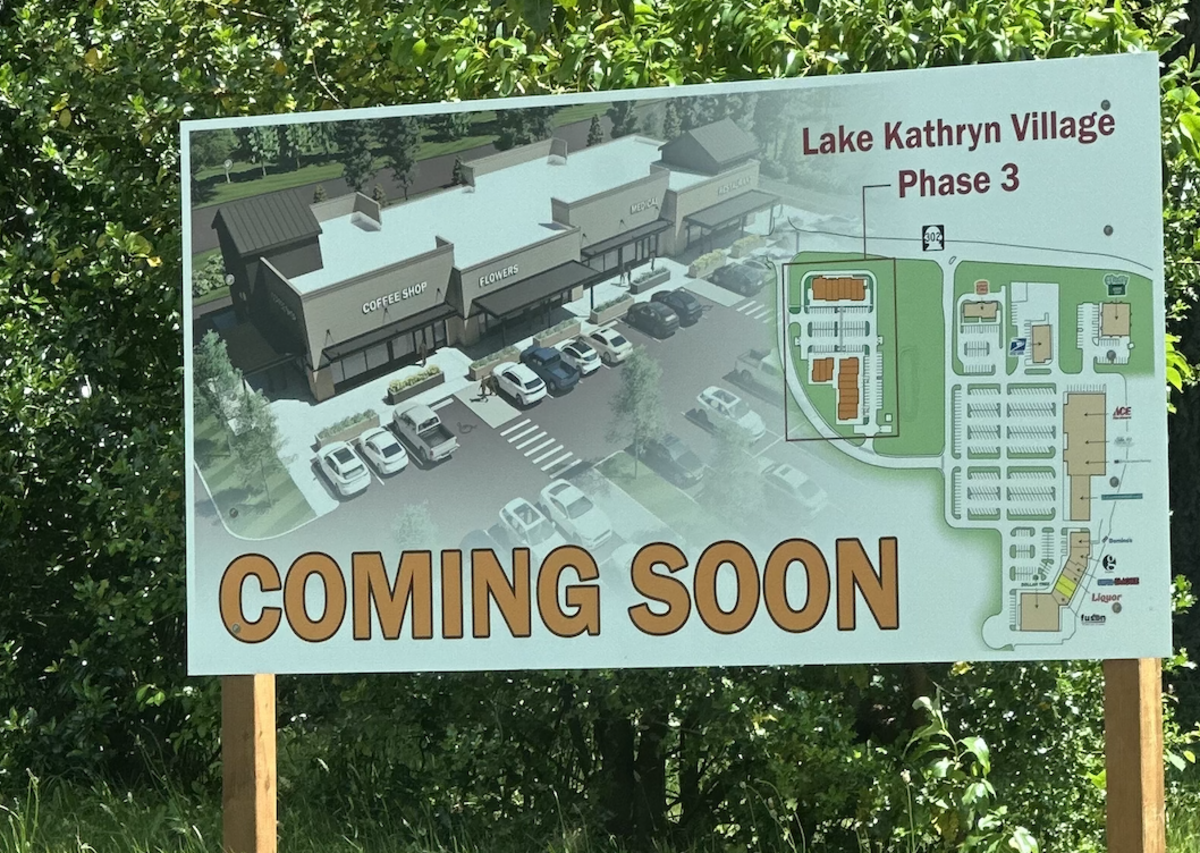 A billboard near the Lake Kathryn Shopping Center in Key Peninsula touts upcoming Phase 3 expansion.