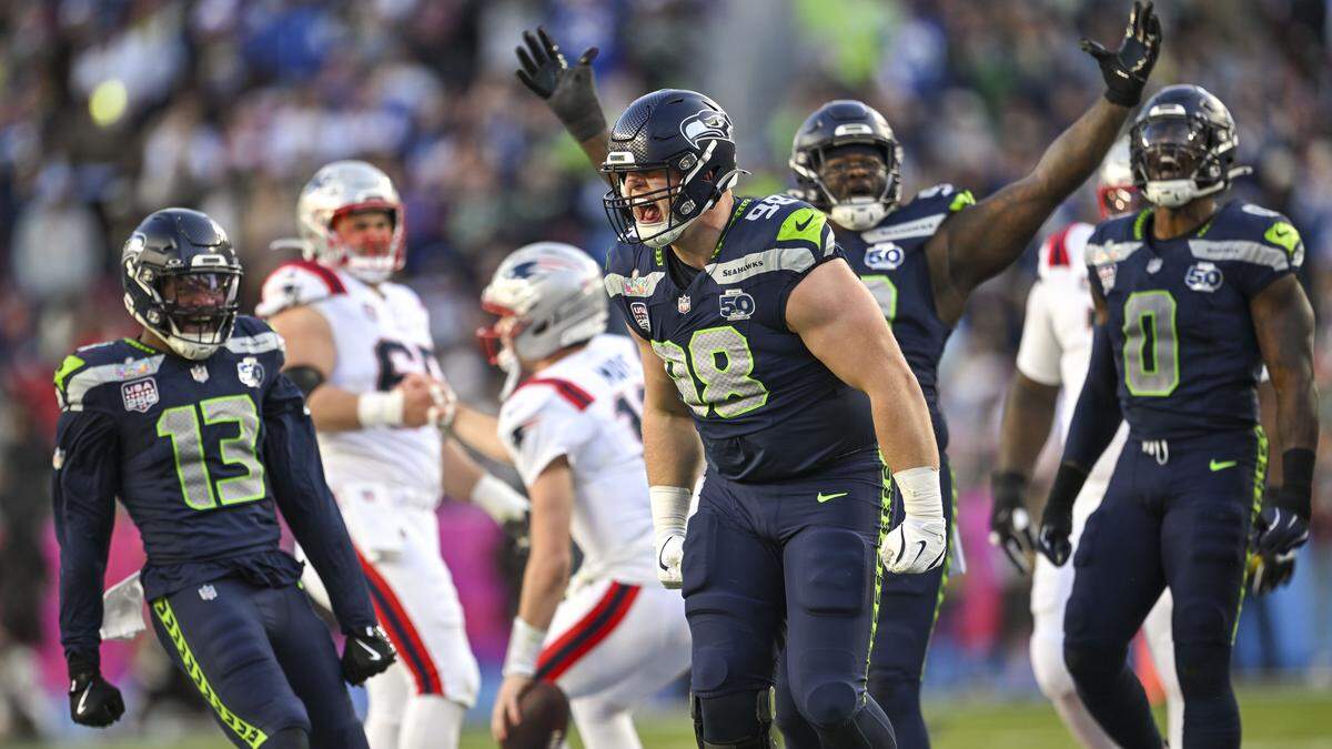 Seattle Seahawks defensive tackle Rylie Mills (98) celebrates after sacking New England Patriots quarterback Drake Maye (10) during the second quarter of Super Bowl LX at Levi's Stadium on Feb. 8, 2026 in Santa Clara, Calif.