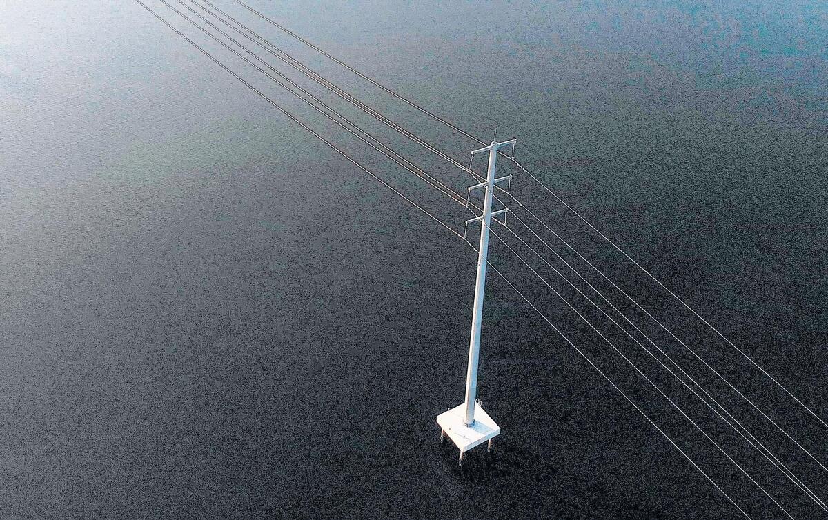 A steel mono pole tower, such as this one on Case Inlet near Allyn, Wash., will replace Tacoma Power’s 92-yer-old power line towers along Henderson Bay and Burley Lagoon in Purdy, Wash., by the end of July 2018.